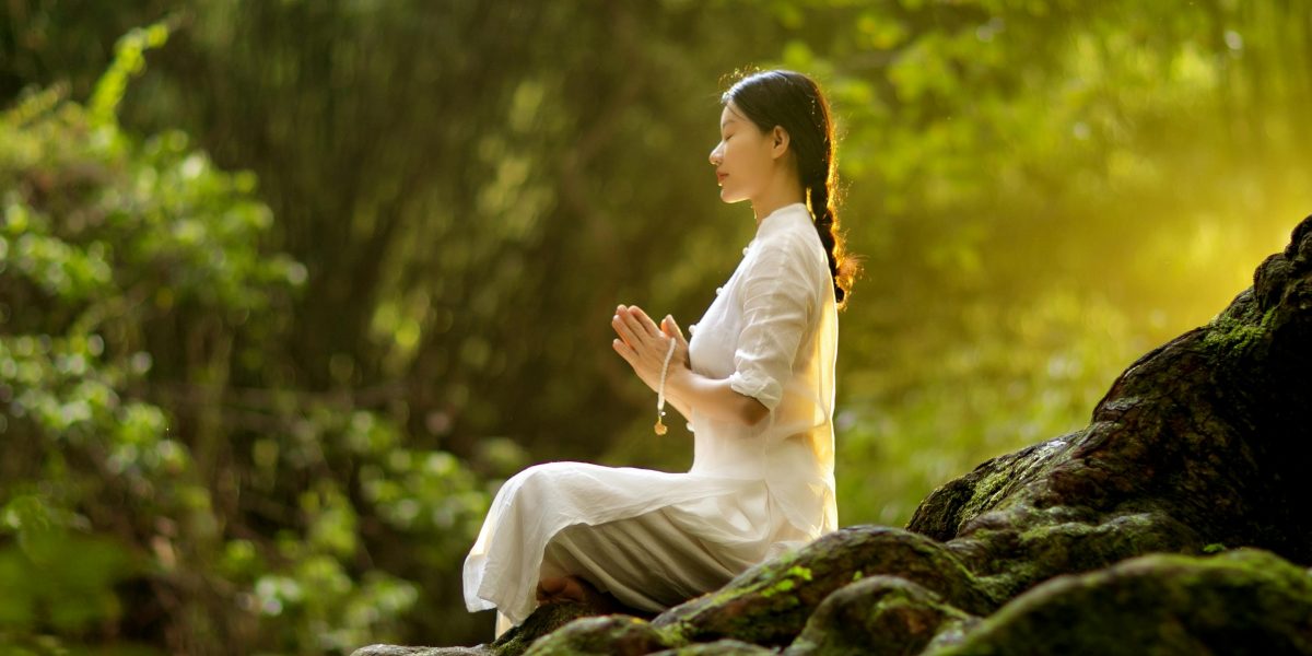 Visualizing practical mind-body practices like breathing exercises and grounding in a calm, natural setting.