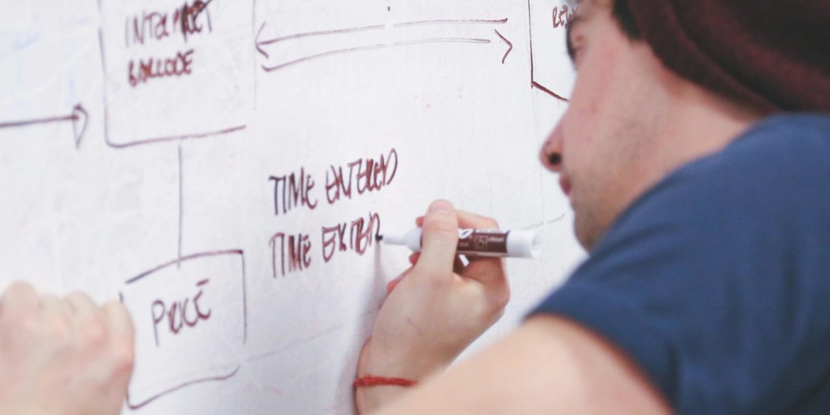 A person actively planning and setting goals, symbolizing commitment to a therapeutic journey.