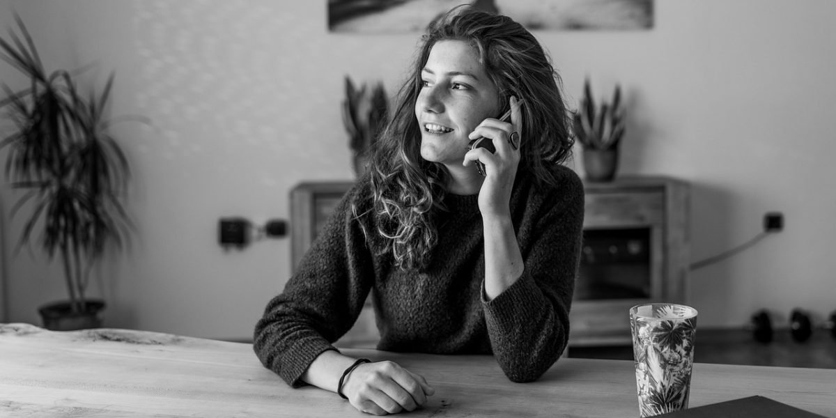 A person engages in a conversation, representing a step towards seeking professional mental health support.