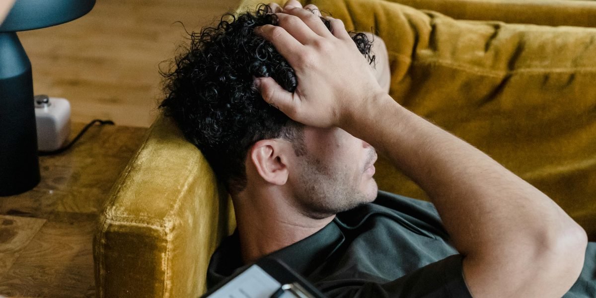 An individual engaged in a counseling session, seeking professional help for their mental health.