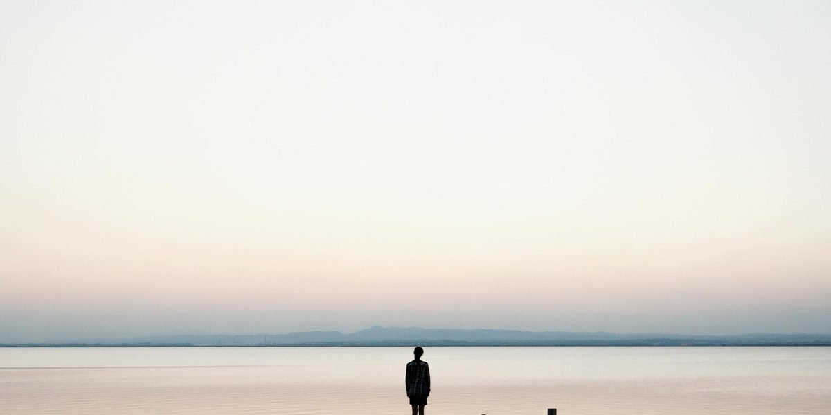 A person in a calm setting, reflecting thoughtfully, symbolizing the process of understanding complex emotions.