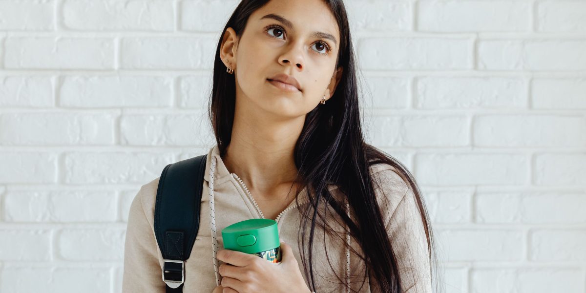 A young person reflecting, representing the common feelings of worry and nervousness teens experience.