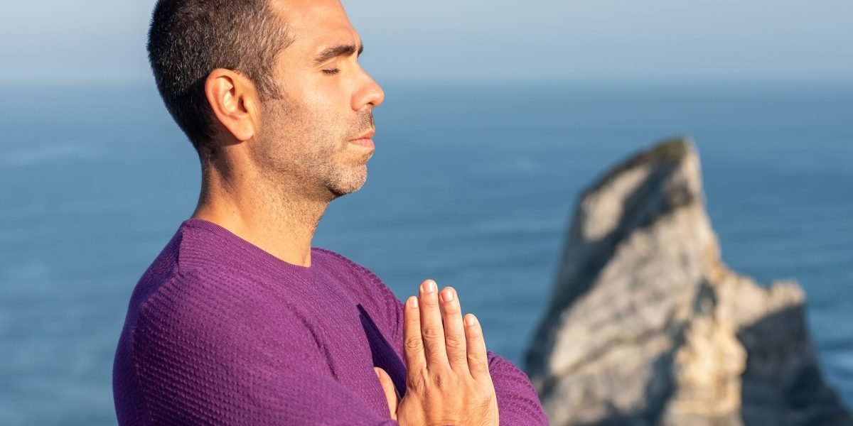 A person engaging in mindful breathing exercises to calm their mind and reduce stress.