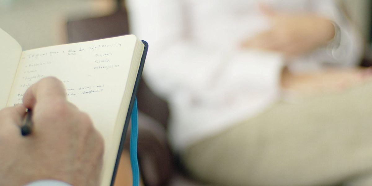 A professional consultation guiding an individual through the complex decision of choosing mental health care.