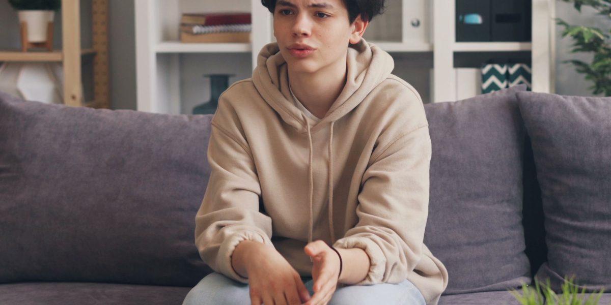 A person engaging in a calm, supportive conversation with a therapist, representing seeking professional help for anxiety.