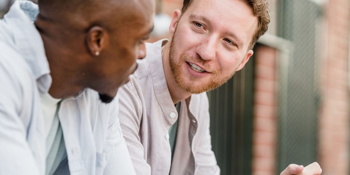 Friends engaging in a supportive conversation, highlighting the importance of social connection for anxiety relief.