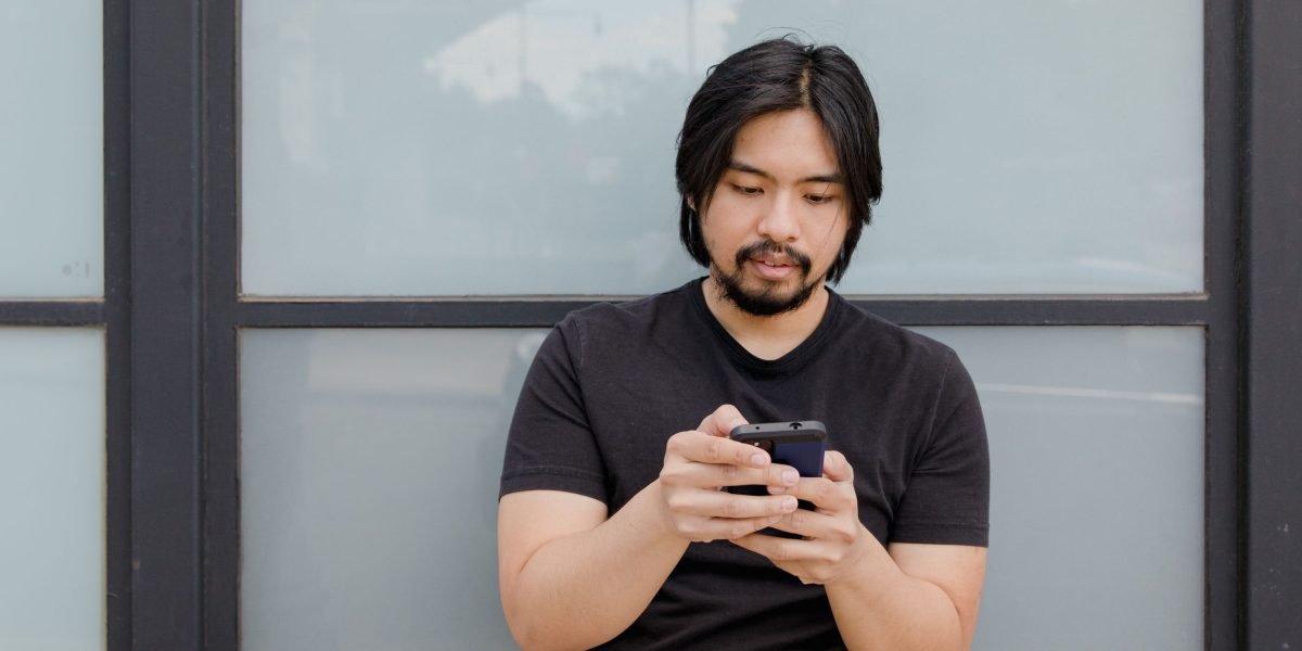 A person finds a moment of calm using a mental health app on their phone, demonstrating accessible self-care.