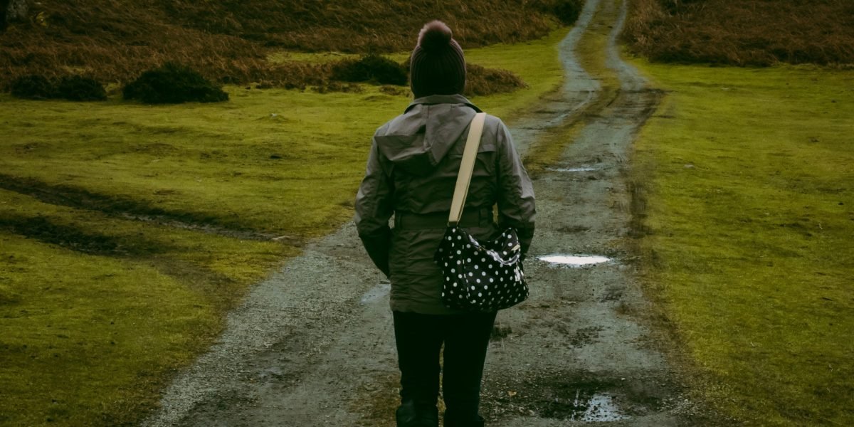 An individual confidently walking forward, symbolizing the journey and progress in mental health recovery.