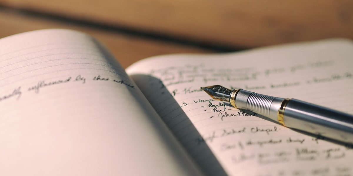 A person engaged in journaling, reflecting on their progress and feelings between therapy sessions as part of practical at-home exercises.