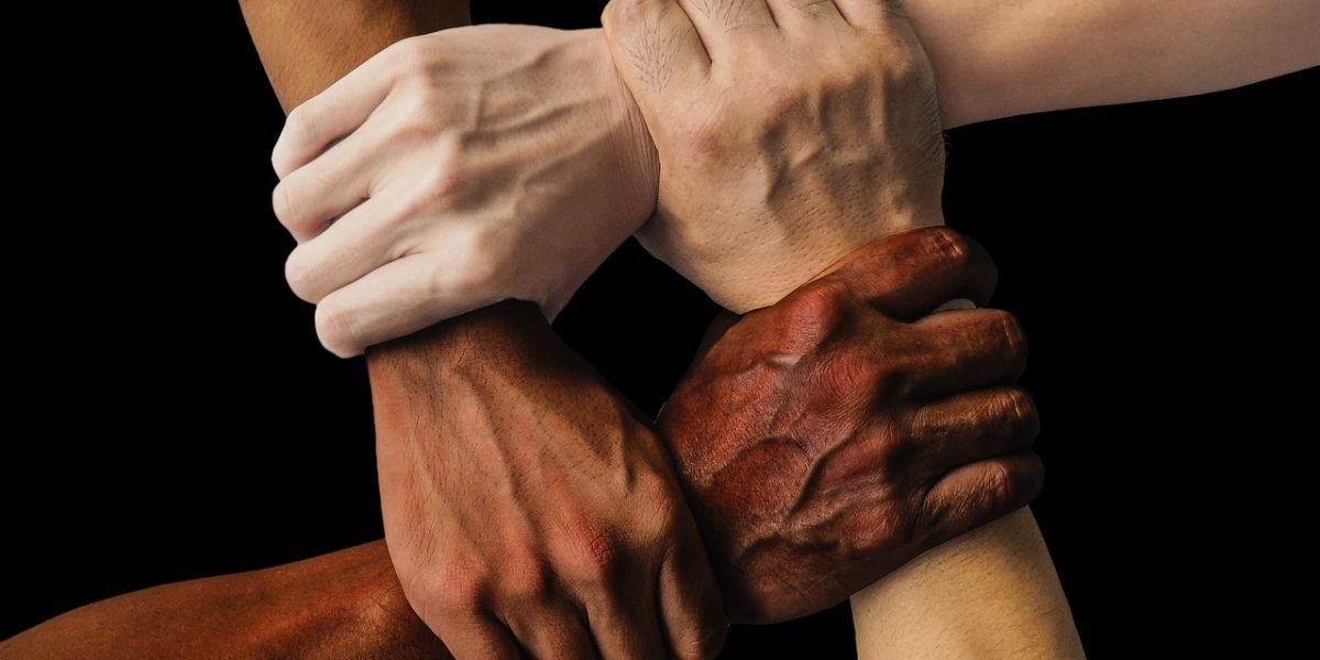 Individuals from diverse backgrounds offering support, highlighting shared mental health journeys.