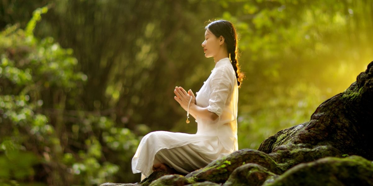 A person calmly practicing deep breathing, demonstrating a simple yet powerful grounding technique for stress reduction.