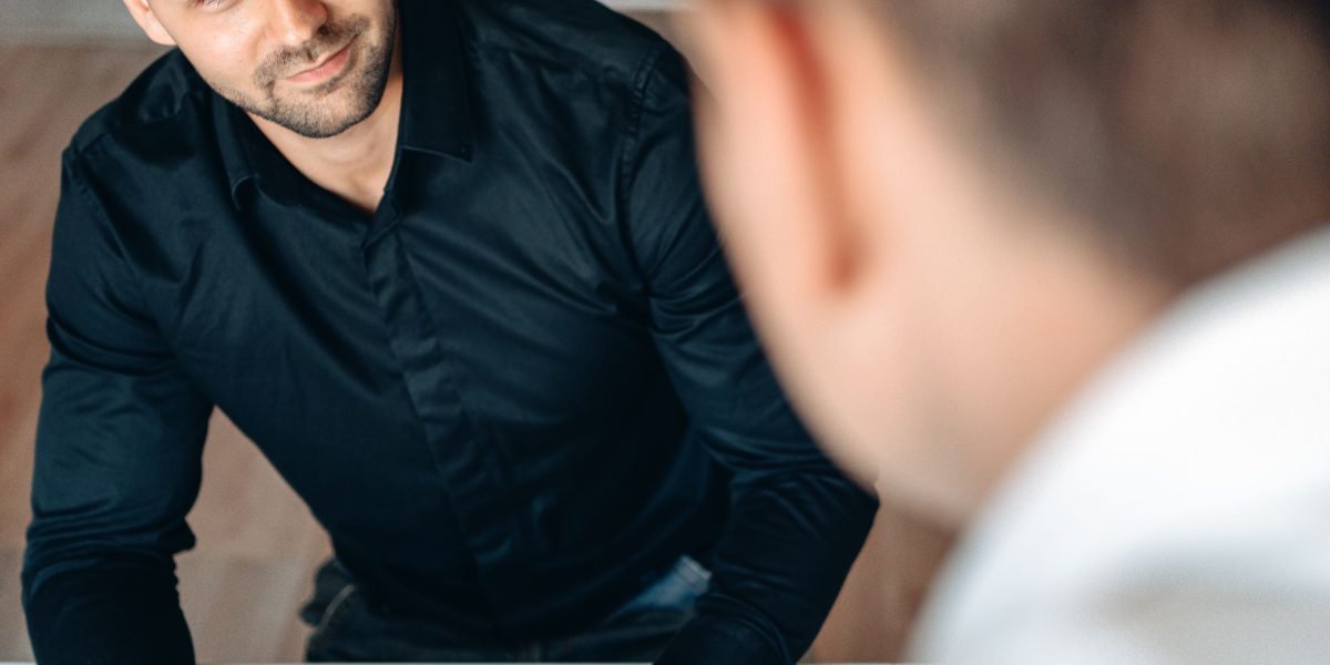 A person in discussion with an advisor, symbolizing the process of selecting a mental health provider.