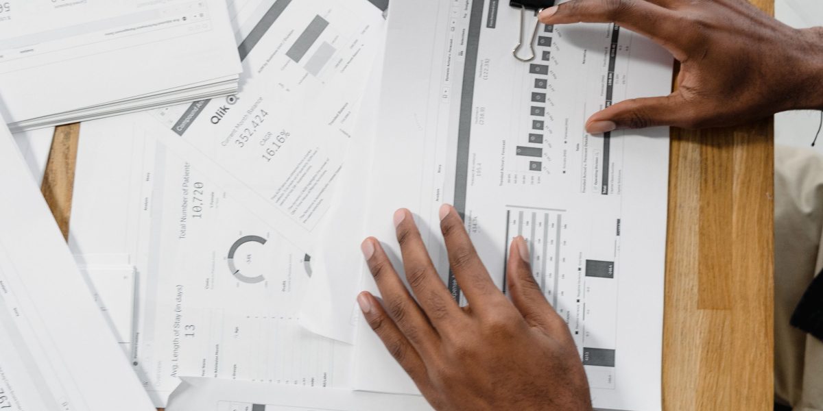 A person reviews financial documents, representing the practical considerations of treatment costs and insurance.
